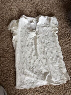 White flowy top